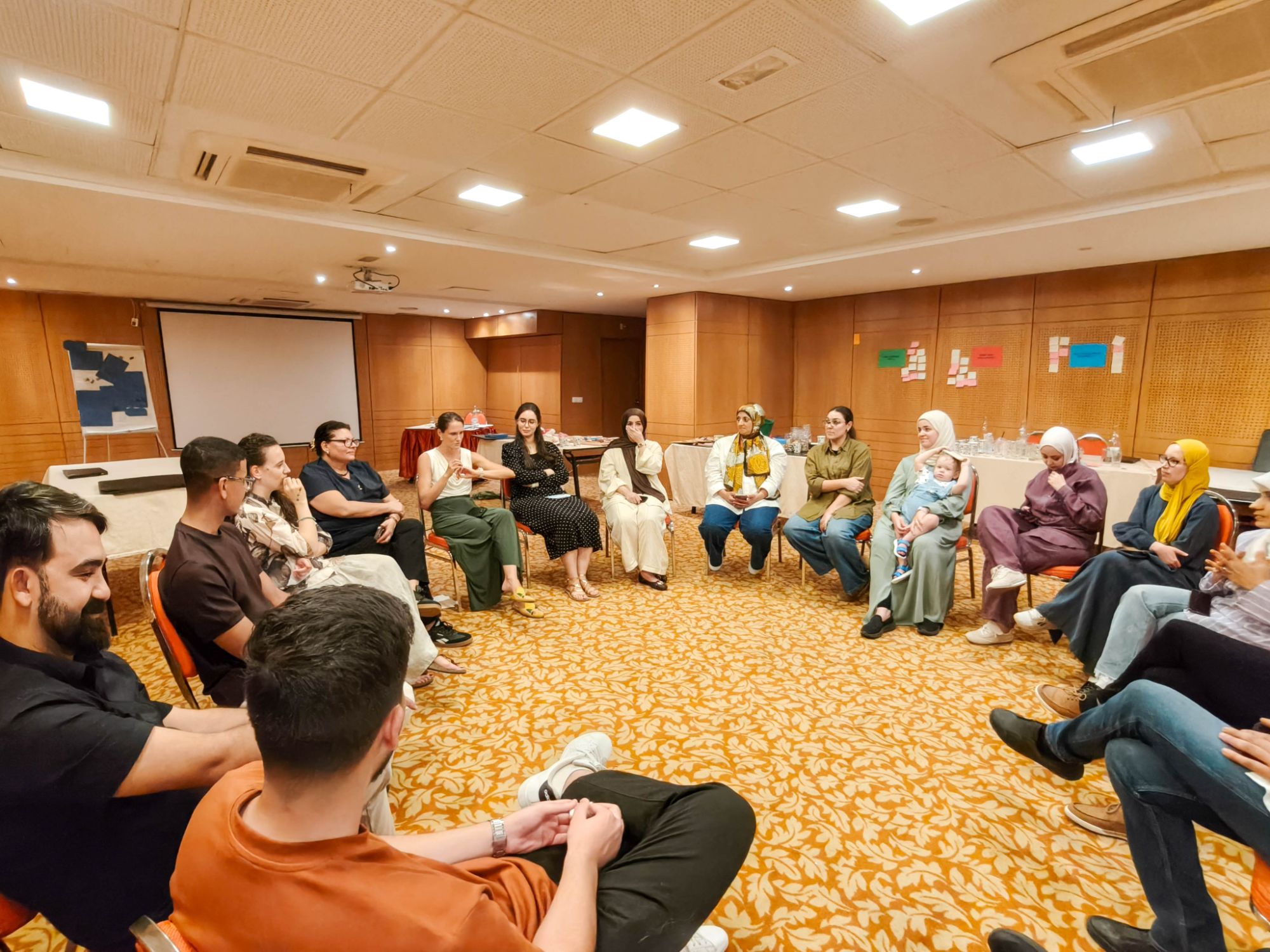 A team in a facilitated reflection circle during a Crafted Visions team-building in Tunis